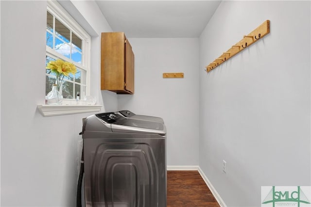 laundry room with cabinets, dark hardwood / wood-style floors, and separate washer and dryer