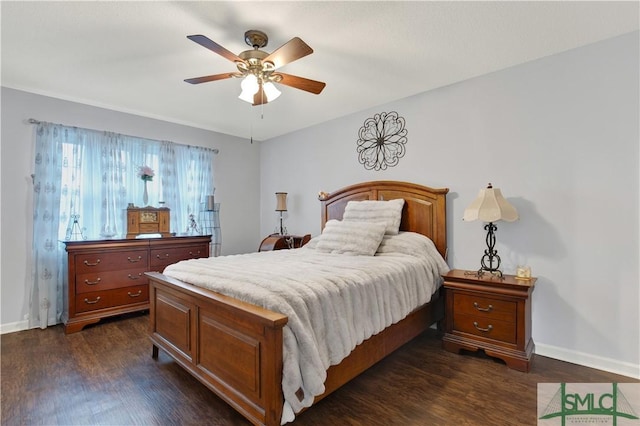 bedroom with ceiling fan and dark hardwood / wood-style flooring