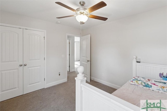 bedroom featuring carpet, ceiling fan, and a closet