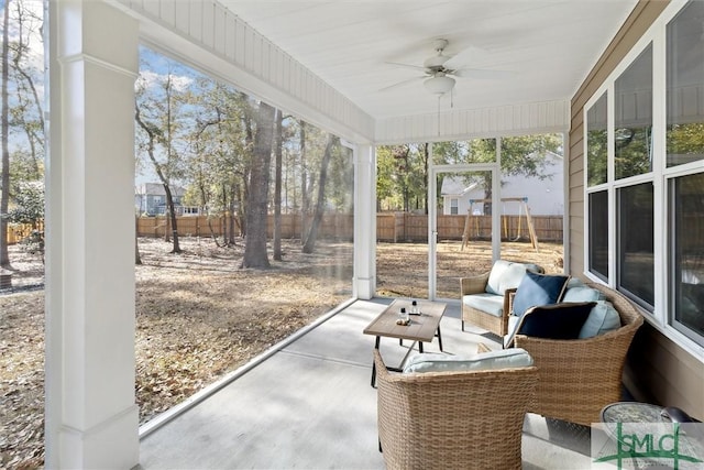 sunroom / solarium featuring ceiling fan