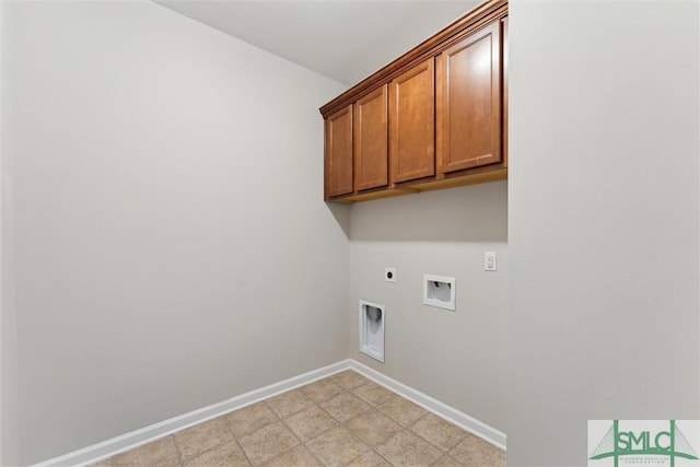 laundry room featuring cabinets, washer hookup, and hookup for an electric dryer