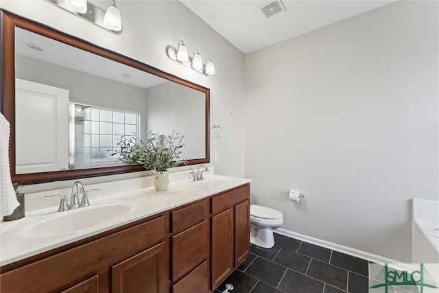 full bathroom with vanity, tile patterned floors, toilet, and separate shower and tub