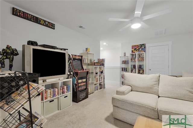 living room featuring visible vents and ceiling fan