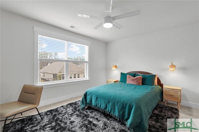 bedroom with carpet, baseboards, visible vents, and ceiling fan