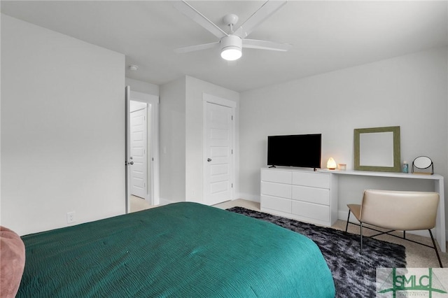 bedroom featuring a ceiling fan and carpet