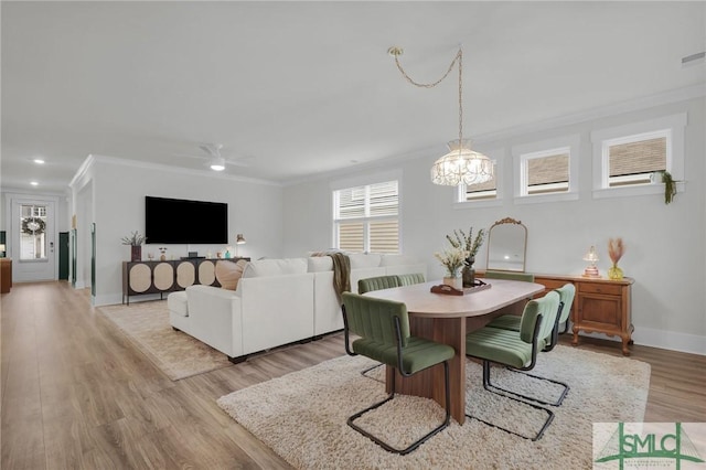 dining area featuring ornamental molding, ceiling fan, and light hardwood / wood-style floors