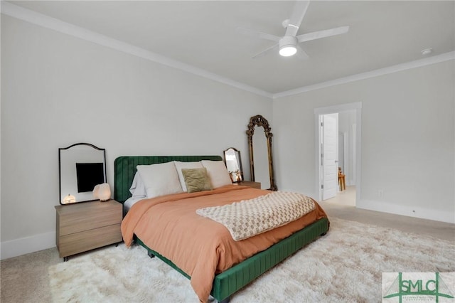 carpeted bedroom with ornamental molding and ceiling fan