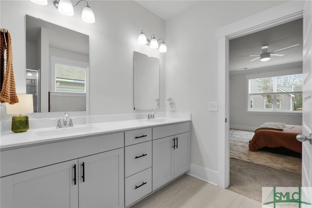 bathroom featuring vanity and ceiling fan