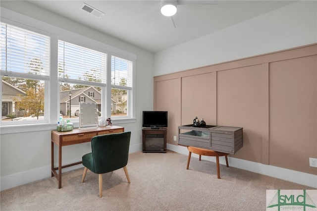 office with light carpet, visible vents, baseboards, and a ceiling fan