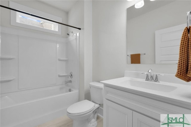 bathroom featuring vanity, toilet, and shower / bathtub combination