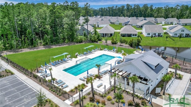 birds eye view of property with a residential view and a water view