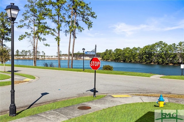 view of road featuring a water view