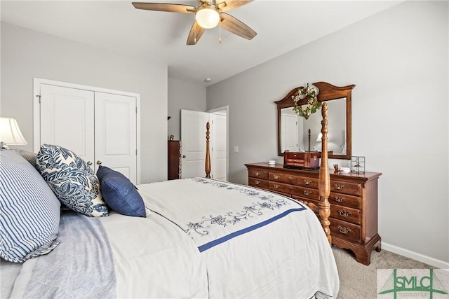 carpeted bedroom with ceiling fan and a closet