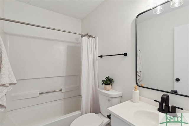 full bathroom with vanity, toilet, a textured ceiling, and shower / bath combo