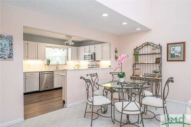 5 Shipwatch Cir, Tybee Island, GA 31328 - carpeted dining room with recessed lighting and a textured ceiling