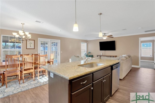 kitchen featuring dark brown cabinetry, sink, stainless steel dishwasher, light stone countertops, and light hardwood / wood-style floors