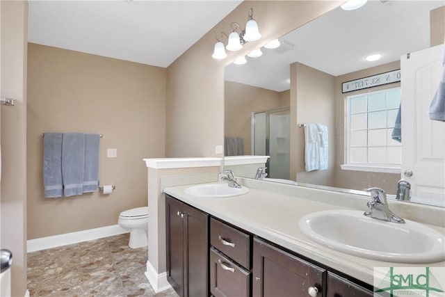 bathroom with vanity, toilet, and an enclosed shower