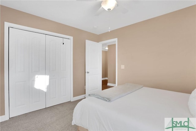 bedroom with carpet floors, ceiling fan, and a closet