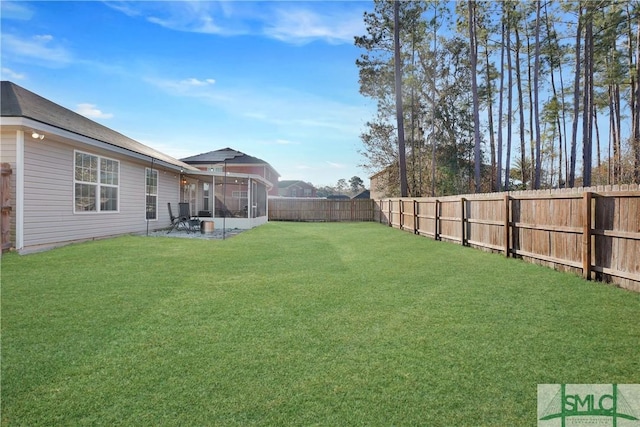 view of yard featuring a patio and a sunroom