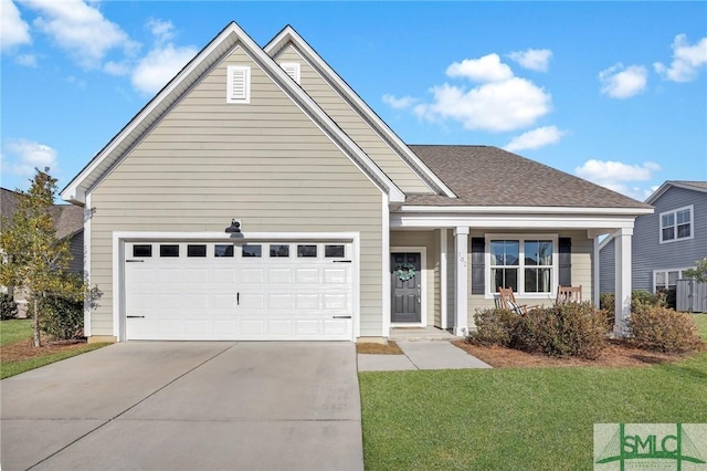 view of front of property with a garage and a front yard