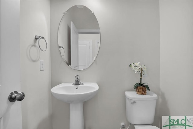 bathroom with toilet and sink