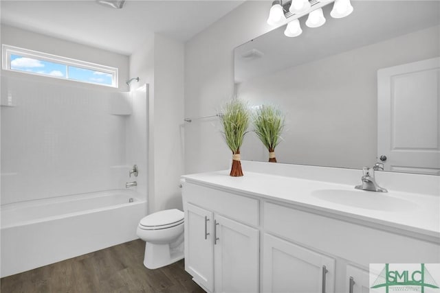 full bathroom featuring shower / bathtub combination, wood-type flooring, toilet, and vanity