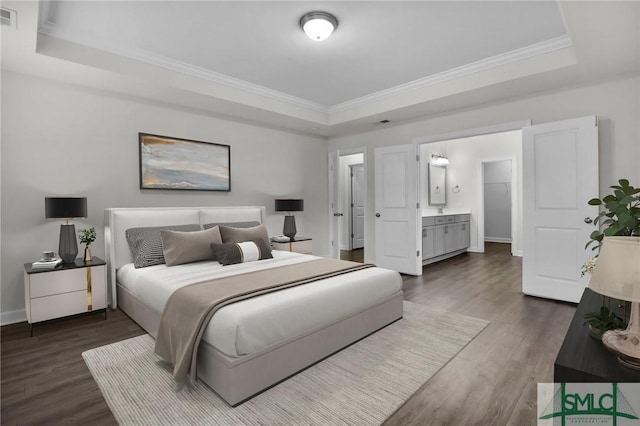 bedroom with a tray ceiling, ornamental molding, and dark hardwood / wood-style floors