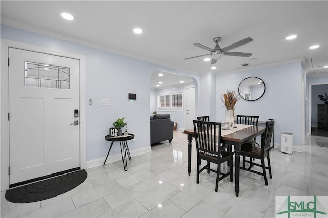 dining area featuring crown molding and ceiling fan