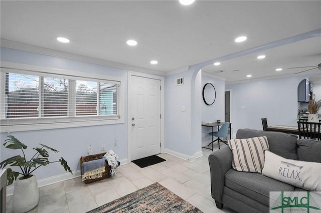 interior space featuring crown molding and ceiling fan