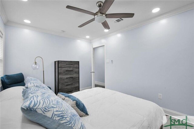 bedroom with baseboards, visible vents, crown molding, and recessed lighting