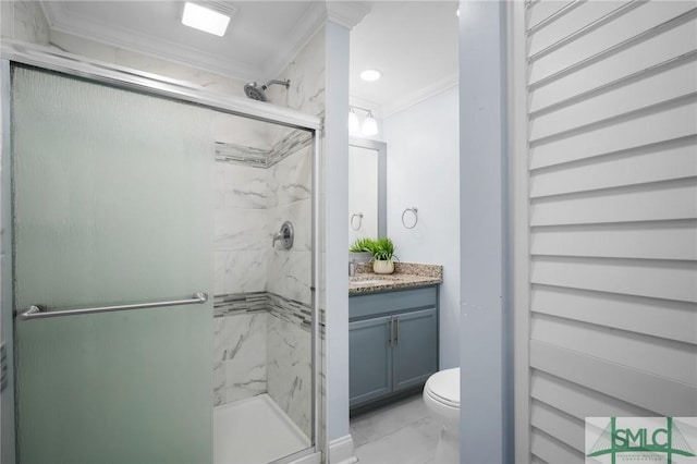 bathroom with a shower with door, ornamental molding, vanity, and toilet