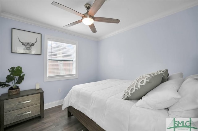 bedroom featuring ceiling fan, ornamental molding, and dark hardwood / wood-style flooring