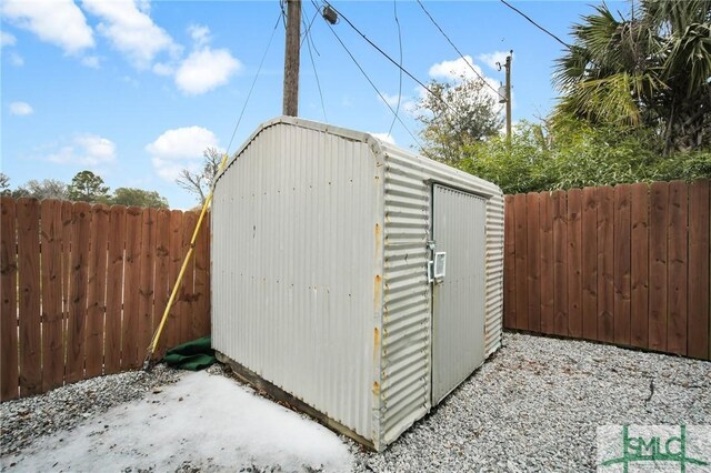 view of shed with a fenced backyard