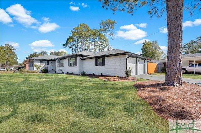 ranch-style home featuring a garage and a front yard