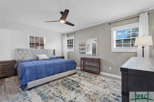 bedroom featuring hardwood / wood-style flooring and ceiling fan