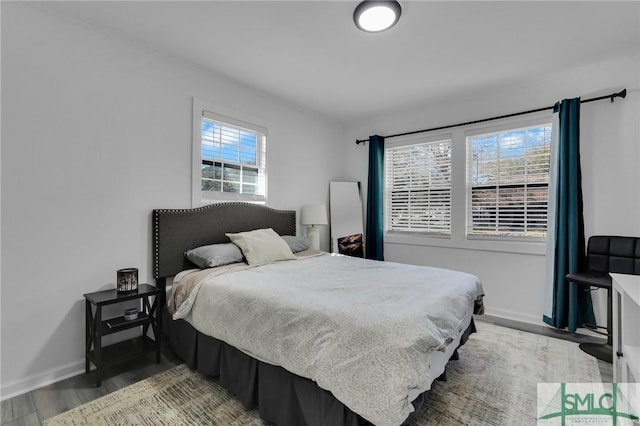 bedroom with hardwood / wood-style floors