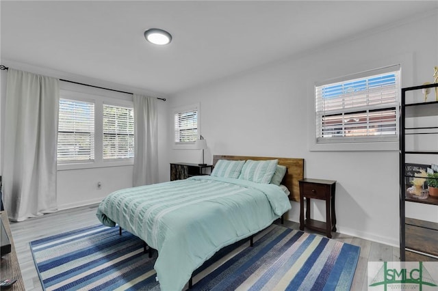 bedroom with light hardwood / wood-style floors