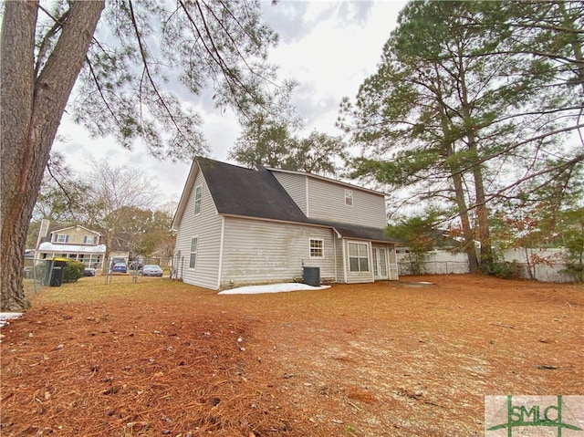 rear view of house featuring a patio area and central air condition unit