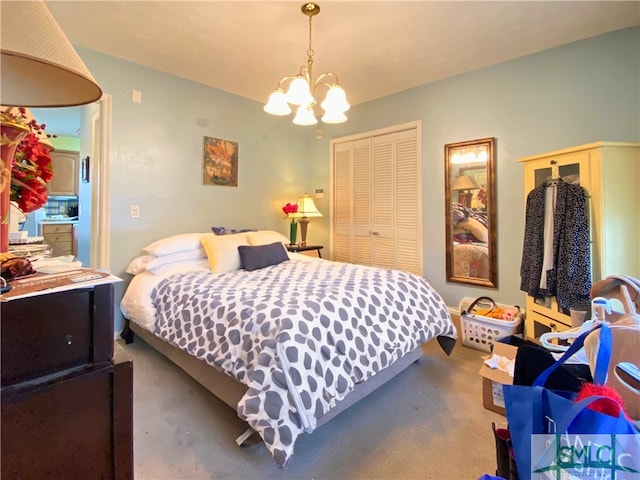 bedroom with an inviting chandelier, carpet flooring, and a closet