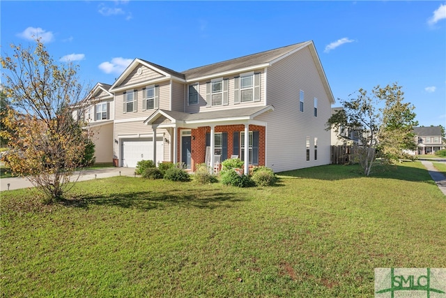 view of front of property featuring a garage and a front yard