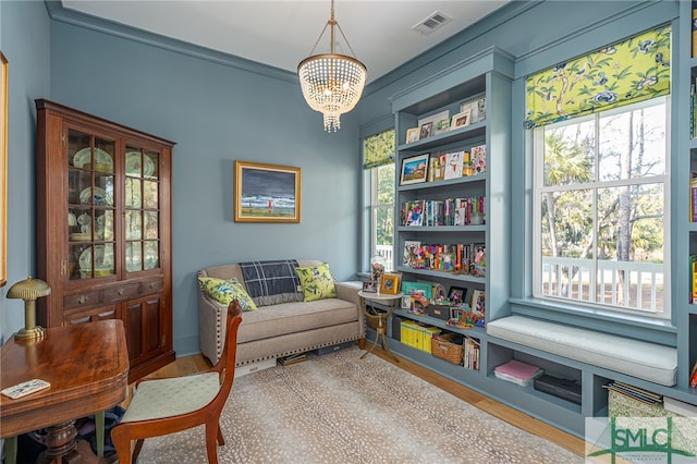 sitting room featuring a notable chandelier