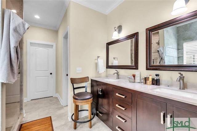 bathroom featuring crown molding and vanity