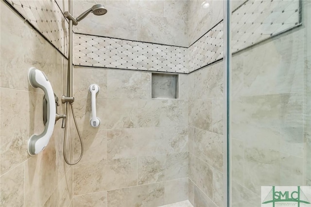 bathroom with a tile shower