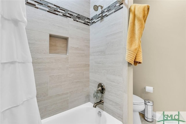 bathroom with toilet and shower / bath combo with shower curtain