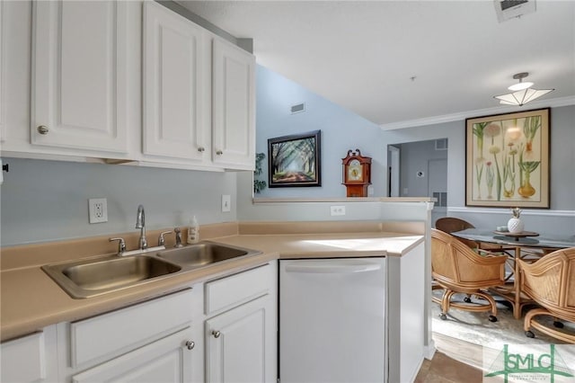 kitchen featuring crown molding, dishwasher, sink, and white cabinets