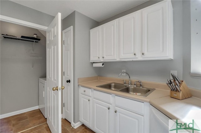 washroom with washer / dryer and sink