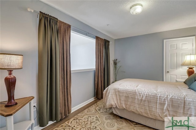 bedroom with wood-type flooring