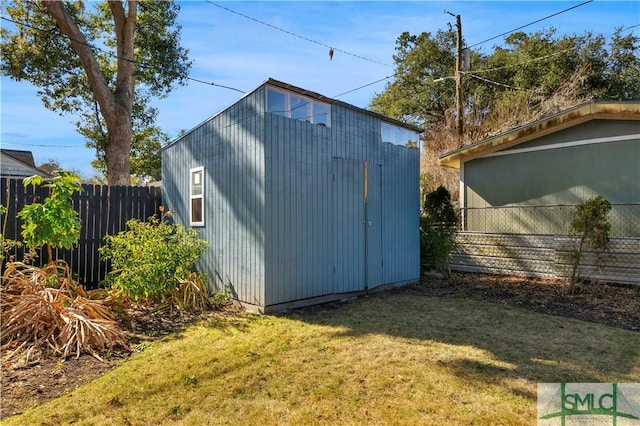 view of shed with fence