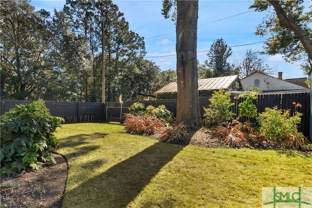 view of yard with a fenced backyard