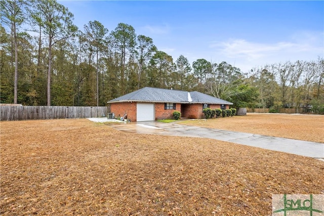 exterior space featuring a garage and a front yard